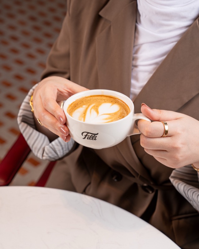 FiLLi Cafe Qatar signature latte in crockery cup